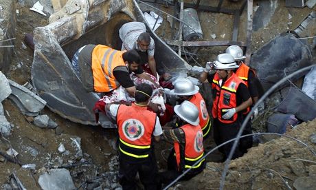 Rescuers remove the body of a member of the al-Najar family after a reported Israeli strike in Gaza