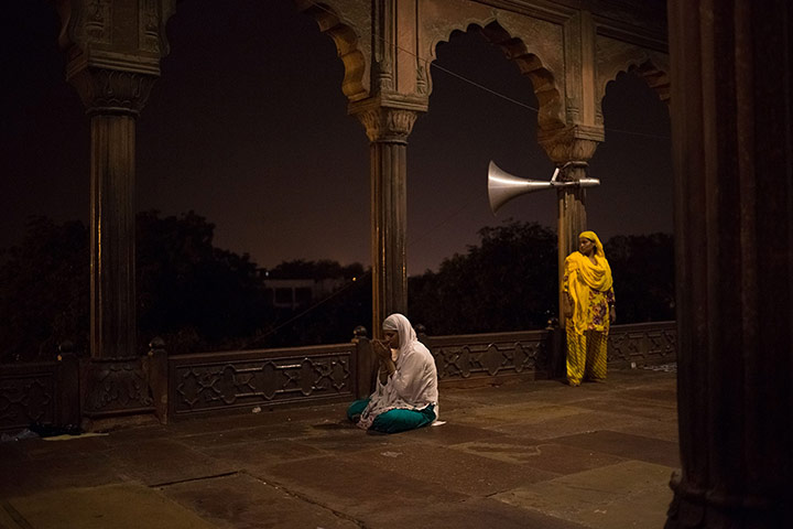 20 photos: an Indian Muslim worshipper offers prayers at Jama Masjid in New Delhi