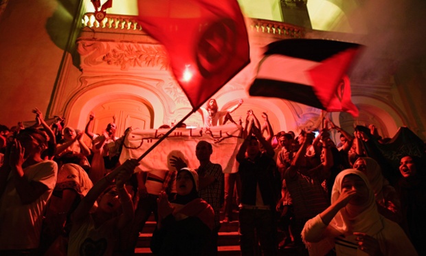 Tunis, Tunisia: Demonstrators shout slogans and wave flags at Avenue Habib Bourguiba