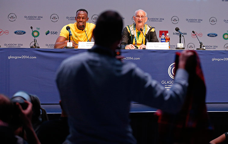 tom jenkins day 3: Usain Bolt is offered a red kilt by a reporter