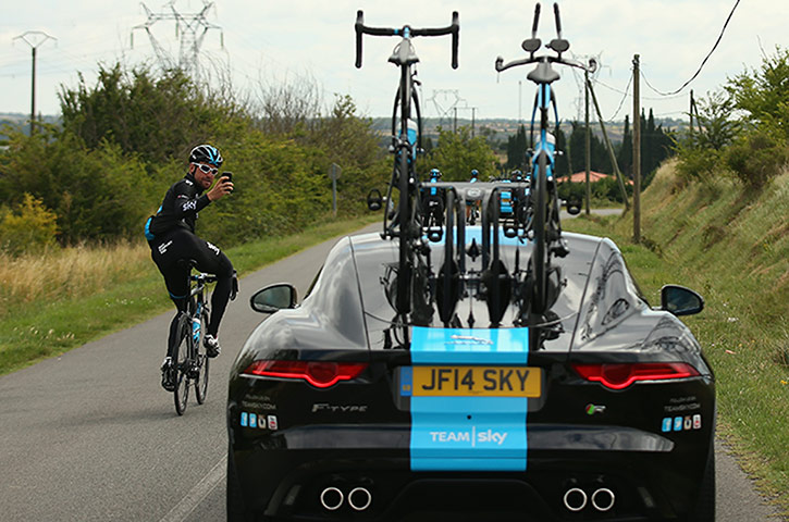 Best TDF 2014: It's a rest day and Bernhard Eisel of Austria takes a photo of a new Jaguar