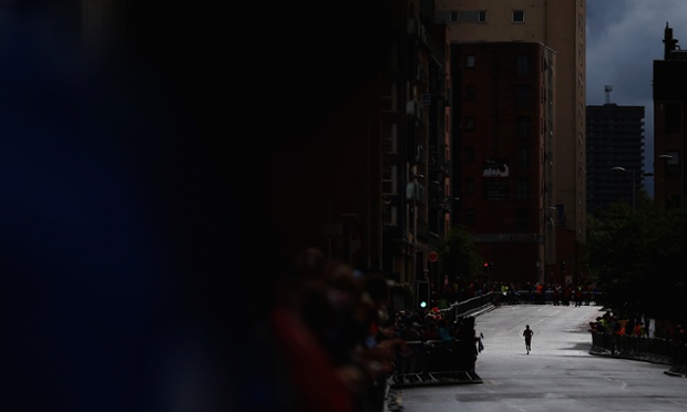 Glasgow, UK: A competitor runs through the city centre during the Women's Marathon on day four of the Glasgow 2014 Commonwealth Games.