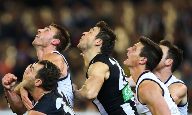 Melbourne, Australia: Team mates from Collingwood Magpies jostle for position with the Adelaide Crows during an AFL match.