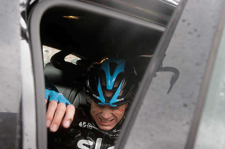 Best TDF 2014: Christopher Froome gets into his team car as he abandons the race