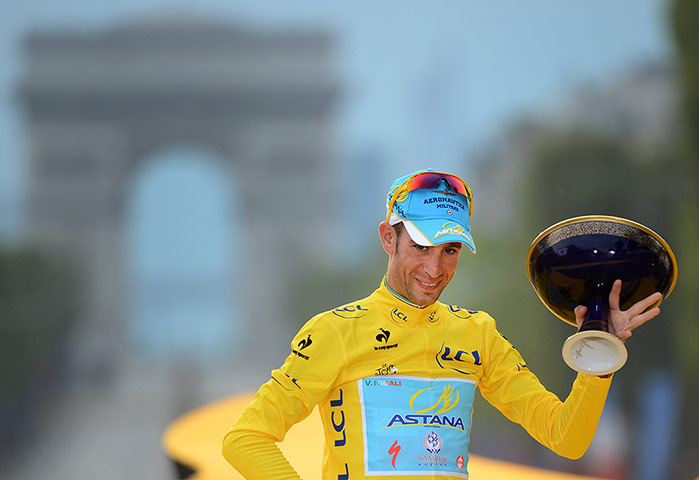 Best TDF 2014: Winner Vincenzo Nibali of Italy wearing the yellow jersey on the podium