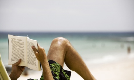 man reading beach