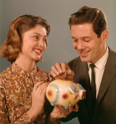 US Money 1960s couple medicare social security saving piggy bank 