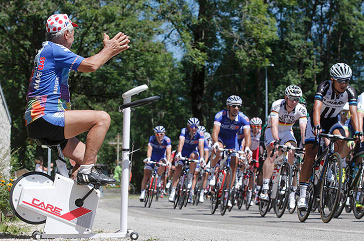 Watching the TDF2014: A cycling fan on a home trainer cheers