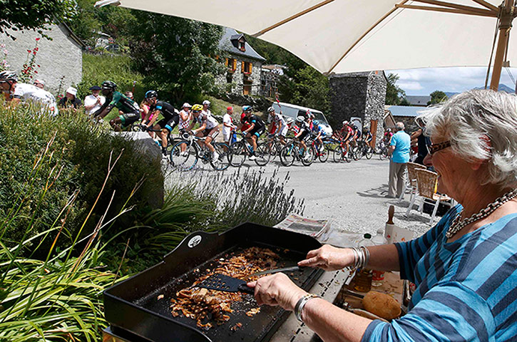 Watching the TDF2014: The peloton cycles on its way past some outdorr French cuisine during Stage
