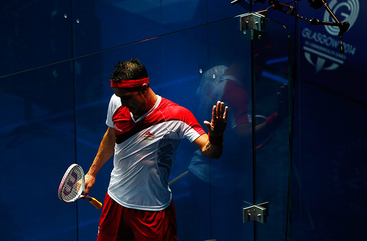 Squash TJ: Peter Barker of England wipes the sweat from his hand on the wall