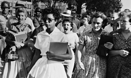 Black students are escorted into Little Rock High School, Arkansas
