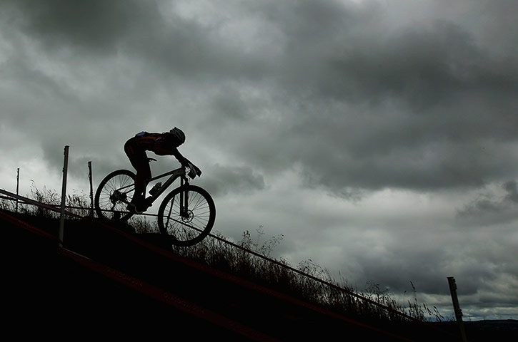 Women's Mountain Biking: A rider negotiates an incline 