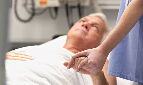 Doctor holding male patient