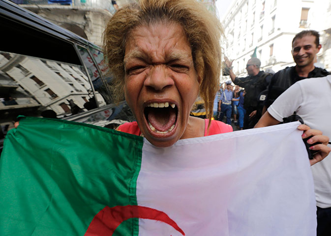 sport: An Algerian soccer fan reacts