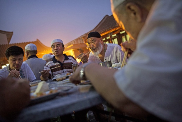 Breaking the fast: Chinese Muslims of the Hui ethnic minority enjoy their daily meal at the historic Niujie Mosque in Beijing.