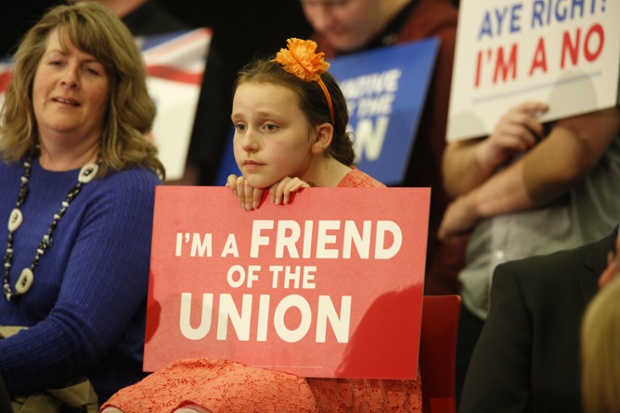 A young girl listens to Prime Minster David Cameron address the Rally for the Union in Perth, Scotland. 
