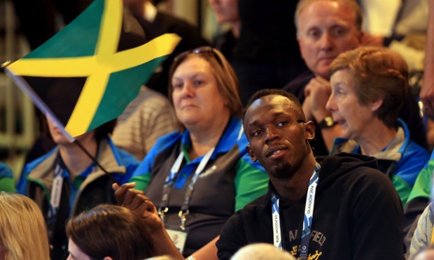Jamaica's Usain Bolt watches the netball match between Jamaica and New Zealand
