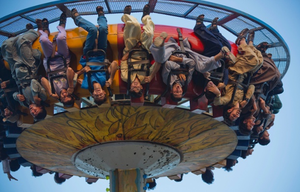 People enjoy a ride during the Eid al-Fitr holiday at a park in Rawalpindi, Pakistan.