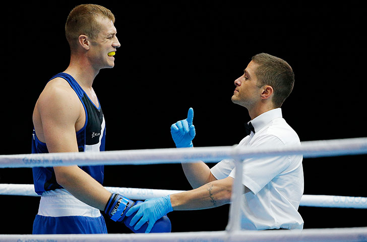 boxing: The referee checks the mouthguard of Warren Baister
