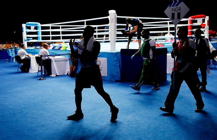 boxing: Efetebor Apochi of Nigeria dances away from the ring 