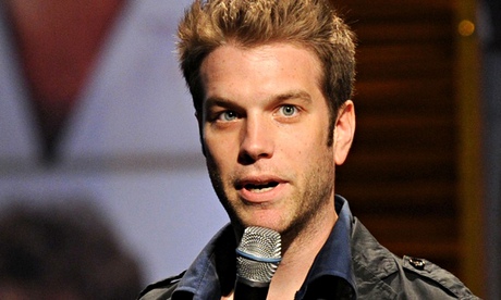 Antony Jeselink holding microphone and looking slightly startled