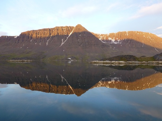 'Midnight sun rising in Kangerluarsk, Disko Fjord, Disko Island, Greenland.'