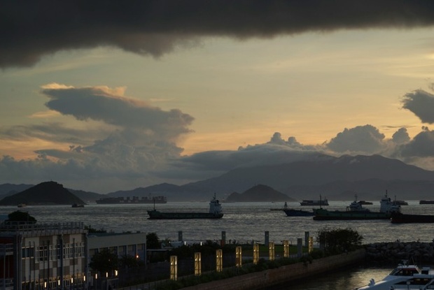 'A thunderstorm ends a fine evening at Victoria Harbour of Hong Kong.'