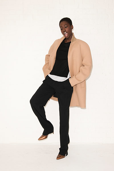 All Ages androgynous: brown coat black jumper black trousers