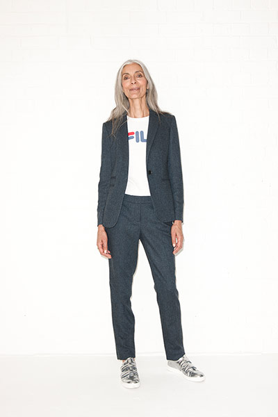 All Ages androgynous: grey trousers grey blazer metallic trainers fila t-shirt