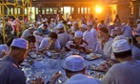 Chinese Muslims eat during the holy month of Ramadan in Beijing, China.