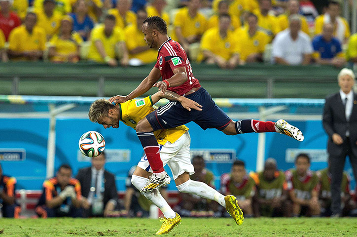 Brazil v  Colombia: Neymar is fouled by Juan Camilo Zúñiga of Colombia