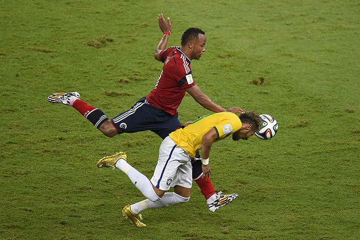 Brazil v Colombia: Neymar is fouled by Juan Camilo Zúñiga of Colombia