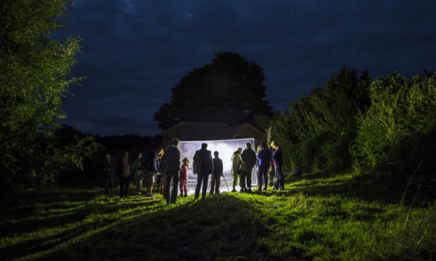 Brill, UK: Moth enthusiasts gather around a light trap on Brill Common during the annual Moth Night census.