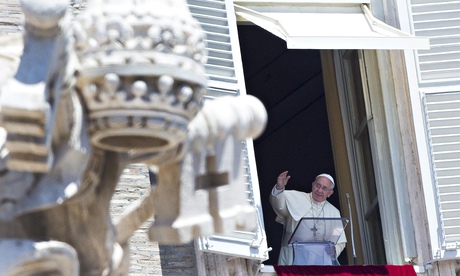 Pope Francis waves to crowds in St Peter's Square as he delivers the Sunday address in Vatican City.