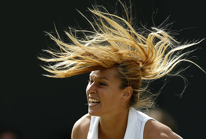 Wimbledon Best: Slovakia's Domimika Cibulkova of Slovakia serves to Lucie Safarova
