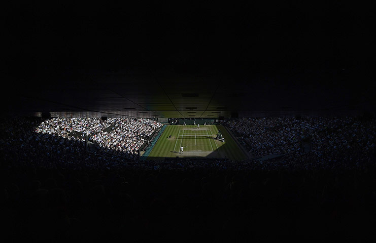 Wimbledon Best: Novak Djokovic of Serbia hits a return against Roger Federer of Switzerland