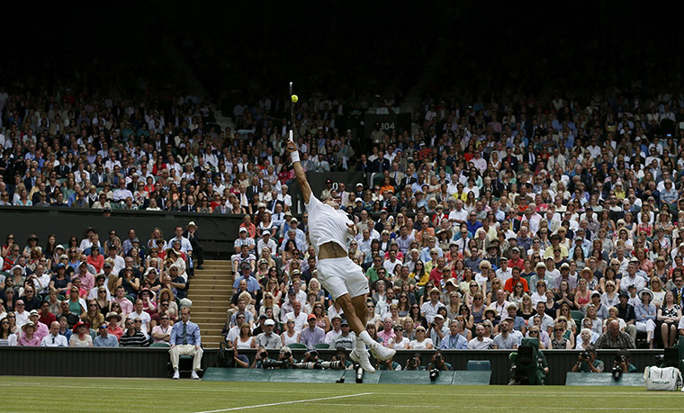 Wimbledon Best: Roger Federer of Switzerland hits a return against Novak Djokovic 