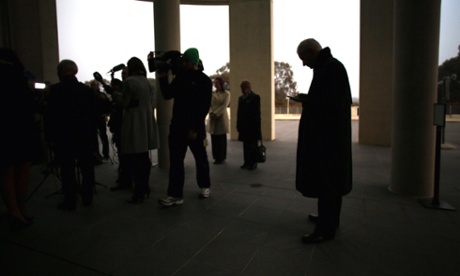 Senator Doug Cameron waits outside the senate doors for their turn to talk to media cameras in the ritual known as 