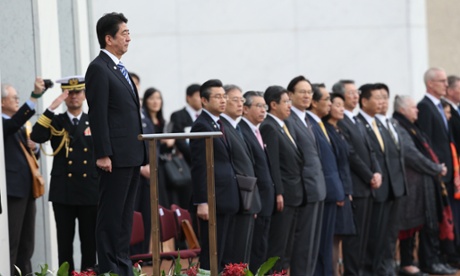 Japanese Prime Minister Shinzo Abe outside parliament house for the 19 gun salute.
