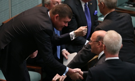 Senator Arthur Sinodinos greets James Packer who have gathered to watch Japanese Prime Minister Shinzo Abe.