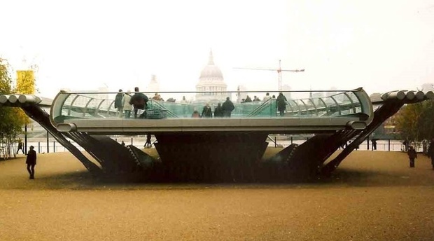 view of st pauls cathedral behind he millennium bridge