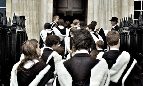 University graduates at Cambridge dressed in robes on graduation day.