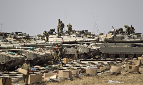 Israeli soldiers and tanks near the border with the Gaza Strip