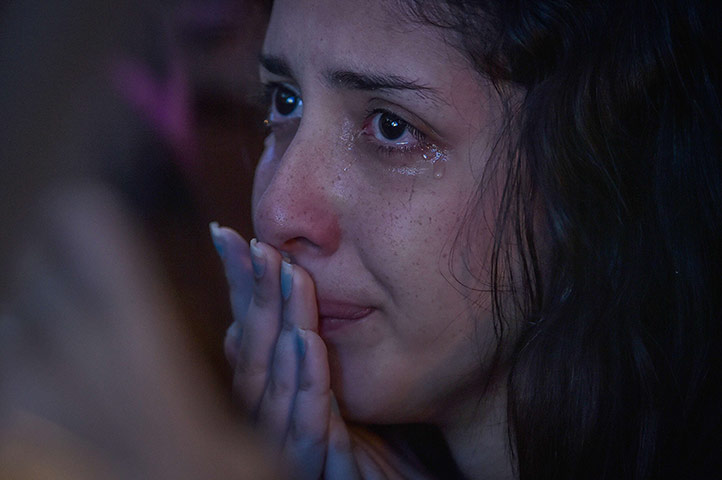 Mourning Brazil: a Brazilian fan reacts while watching the humiliation of her team