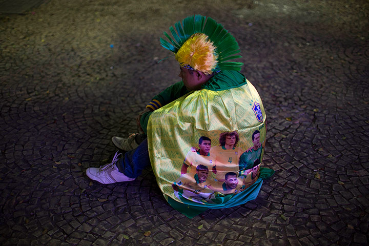 Mourning Brazil: a fan of Brazil sits dejected in São Paulo