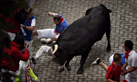 Bill Hillmann is gored in his right thigh by a bull during the third day of the San Fermin festival.