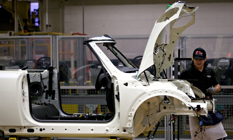 Factory workers produce Mini cars
