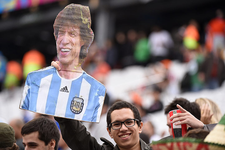 argies v dutch: A football fan holds a cardboard cutout of mick jagger