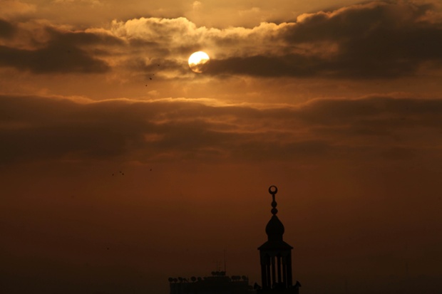 Sunrise over Gaza City as a 72-hour humanitarian ceasefire between Israel and Hamas is announced.