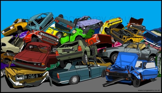 colourful cars crushed and piled on top of one another